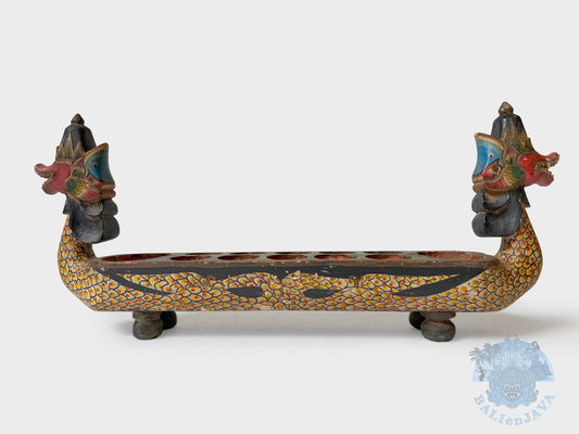 Decorative dragon-shaped board game with colorful patterns on a white background