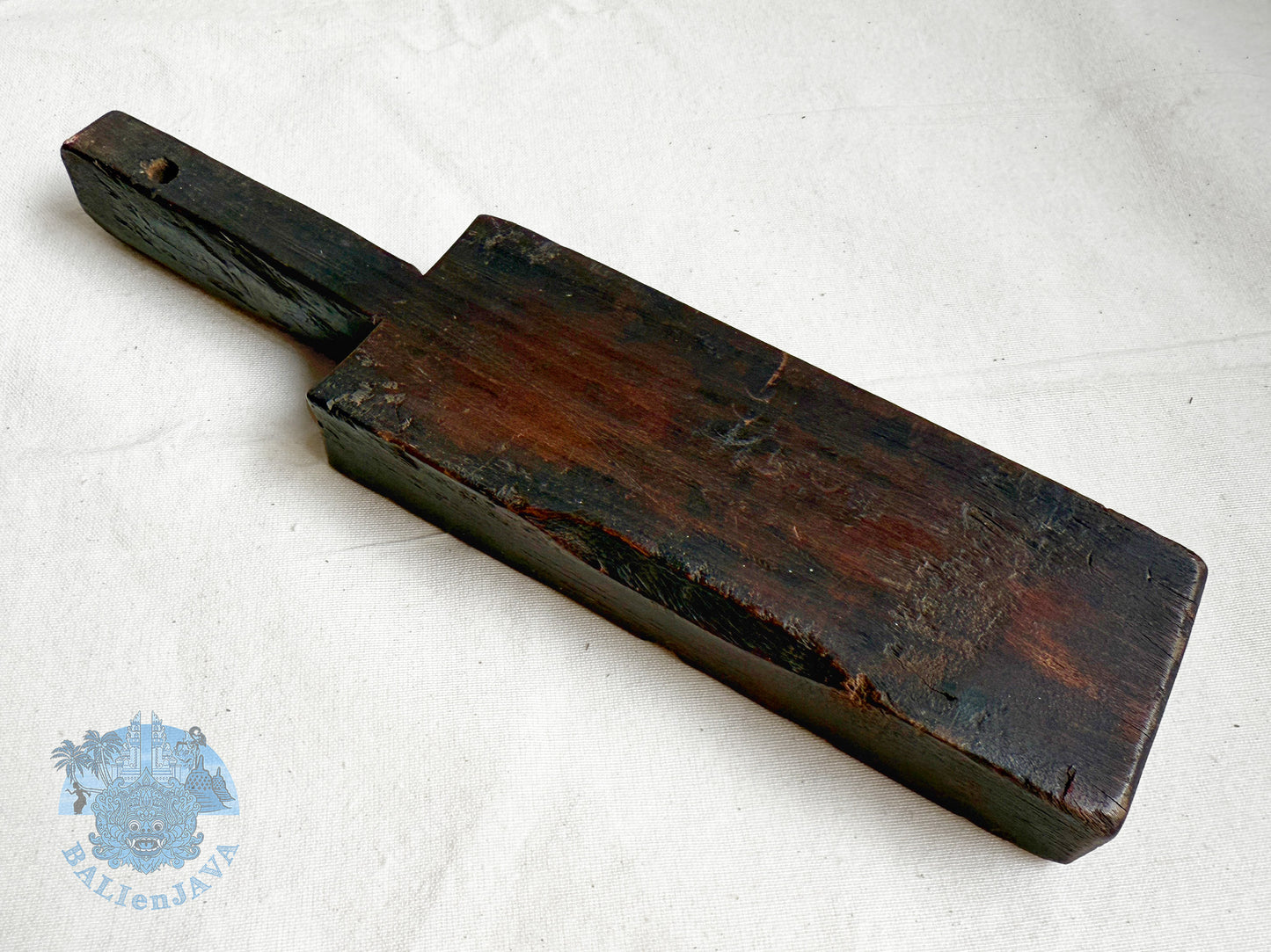 Vintage wooden cookie mold back side on a white background