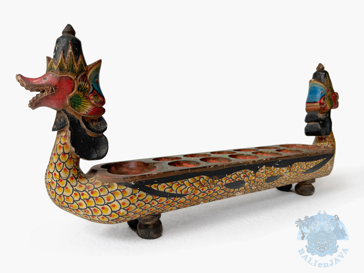 Decorative dragon-shaped board game with colorful patterns on a white background