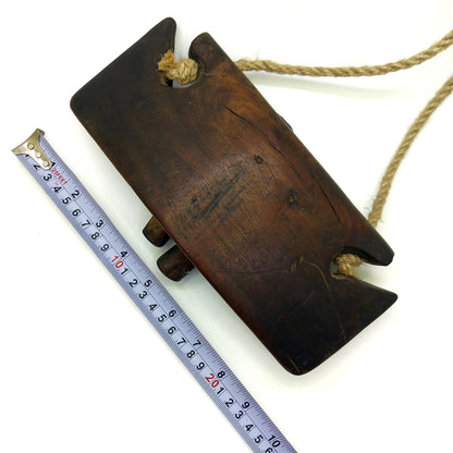 Vintage wooden bell with measurements on a white background