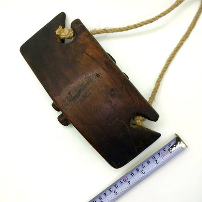 VIntage wooden bell with measurements on a white background