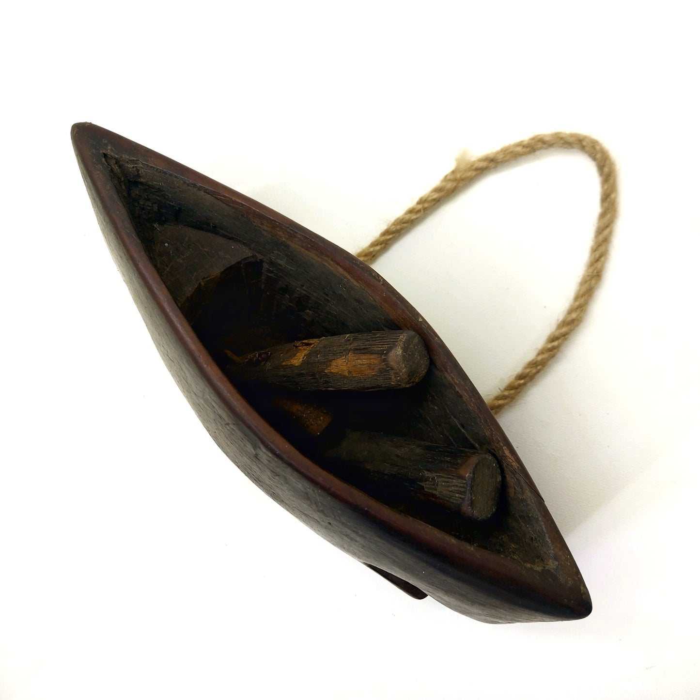 Bottom part of a wooden bell with wooden clappers visible