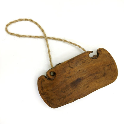 Vintage brown wooden bell on a white background