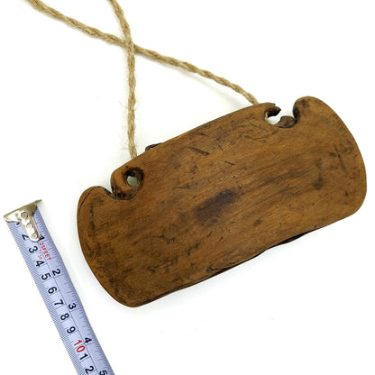 Wooden bell with measurements on a white background