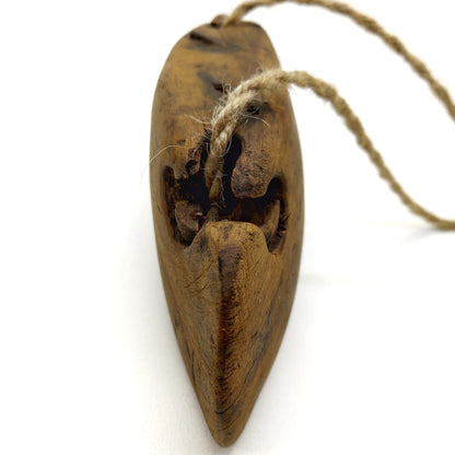 Side part of an old wooden bell with weathered texture