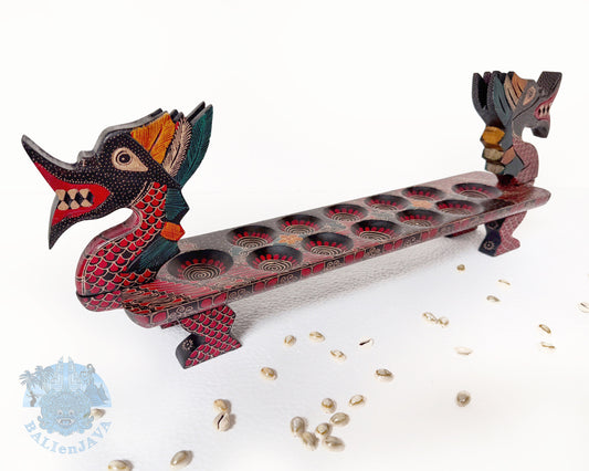 Mancala board game resembling a dragon with a long, narrow body and two heads on a white background.