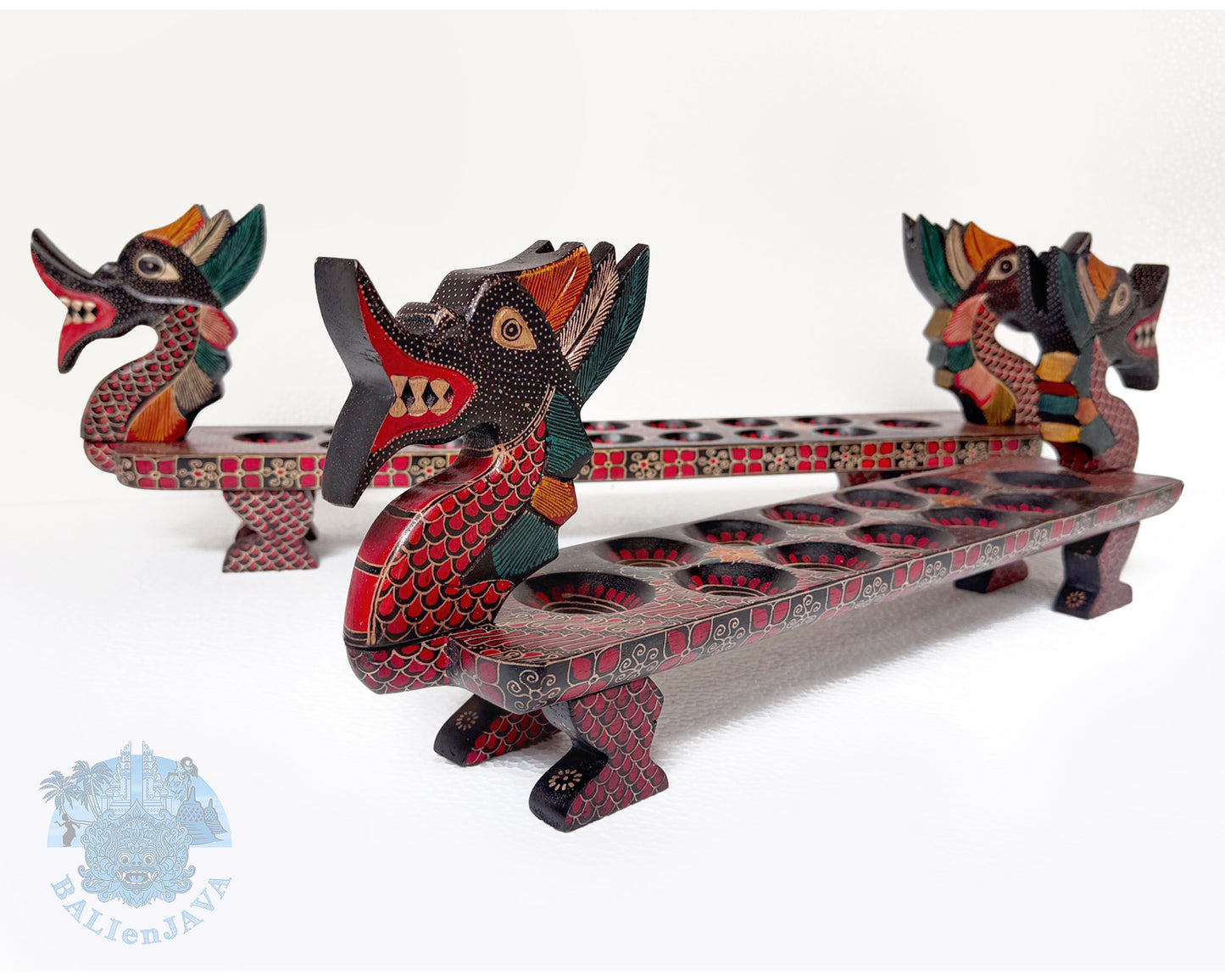 Two pieces of wooden board game with dragon designs on a white background