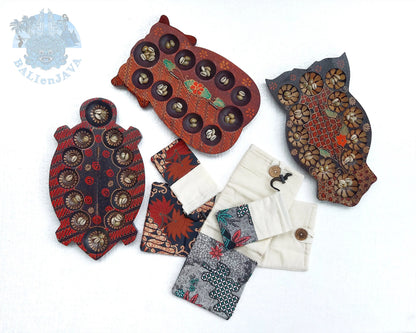 Three animal-shaped mancala game with several matching fabric pouches, arranged on a plain white background.