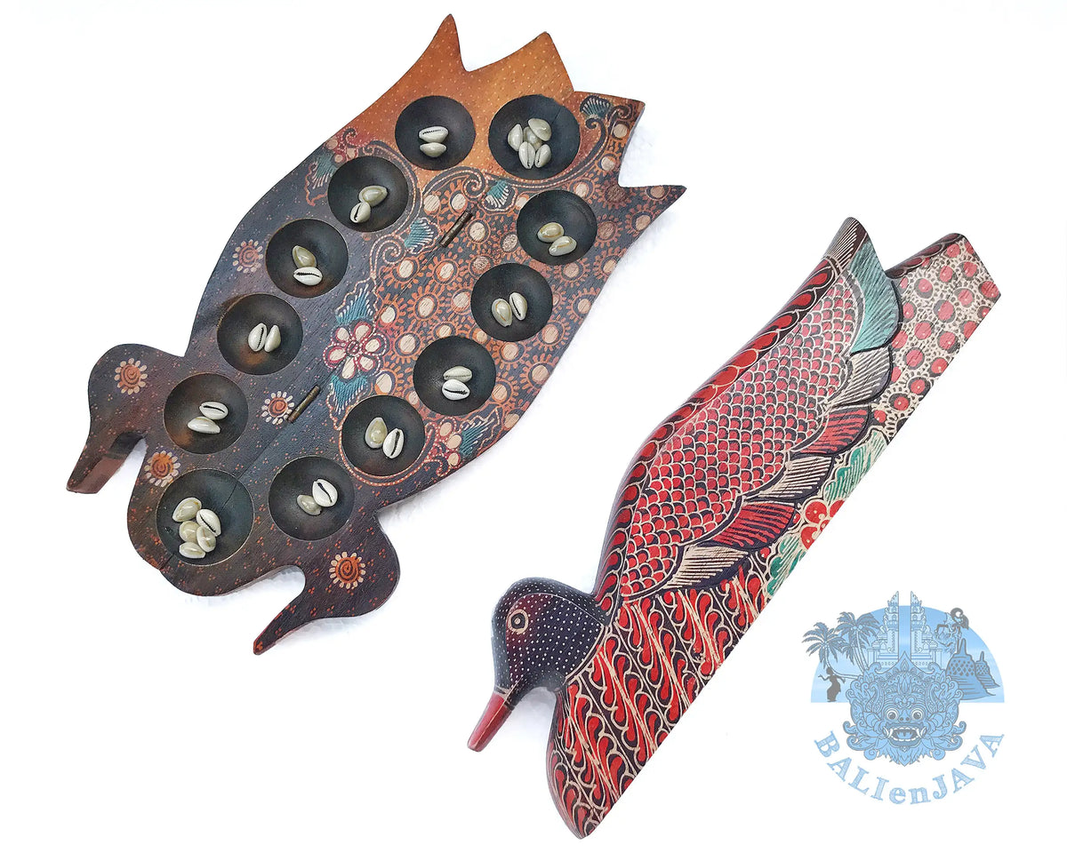 Two hand-painted wooden duck-shaped game boards on a white background, one dark brown and the other red with intricate painted details. 