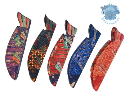Four fish-shaped mancala board games with colorful pattern, arranged on a white background.