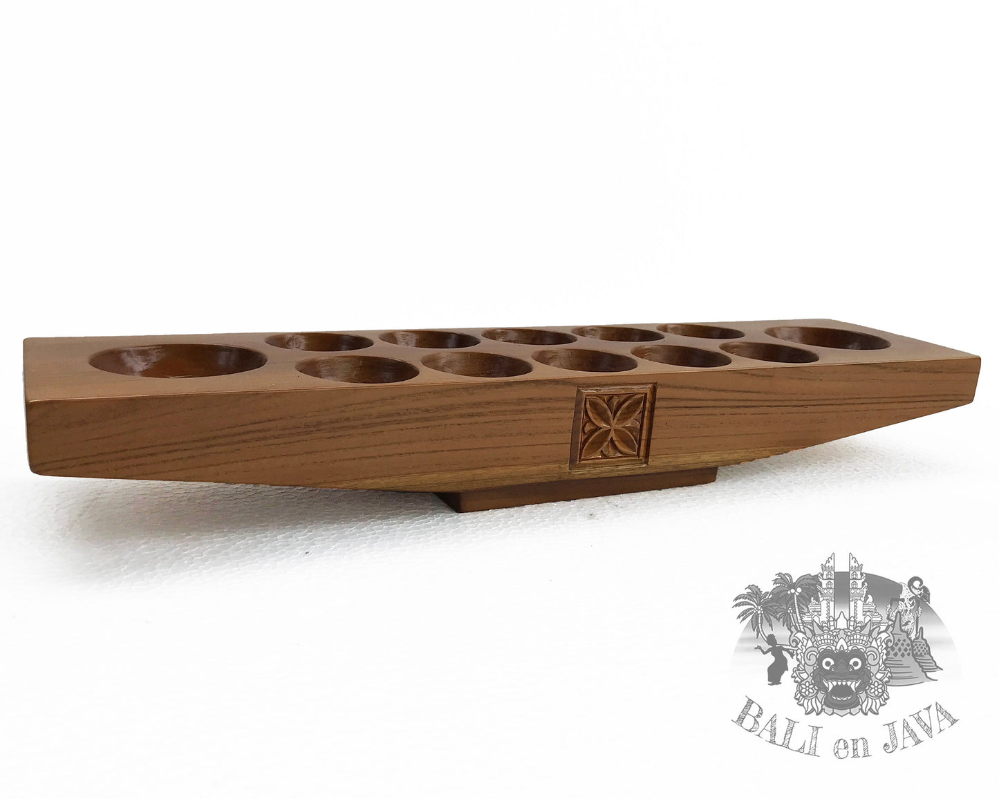 Wooden mancala board game on a white background