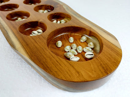 The mancala board game comes with free natural cowrie shells as 'seeds' for gameplay. 
