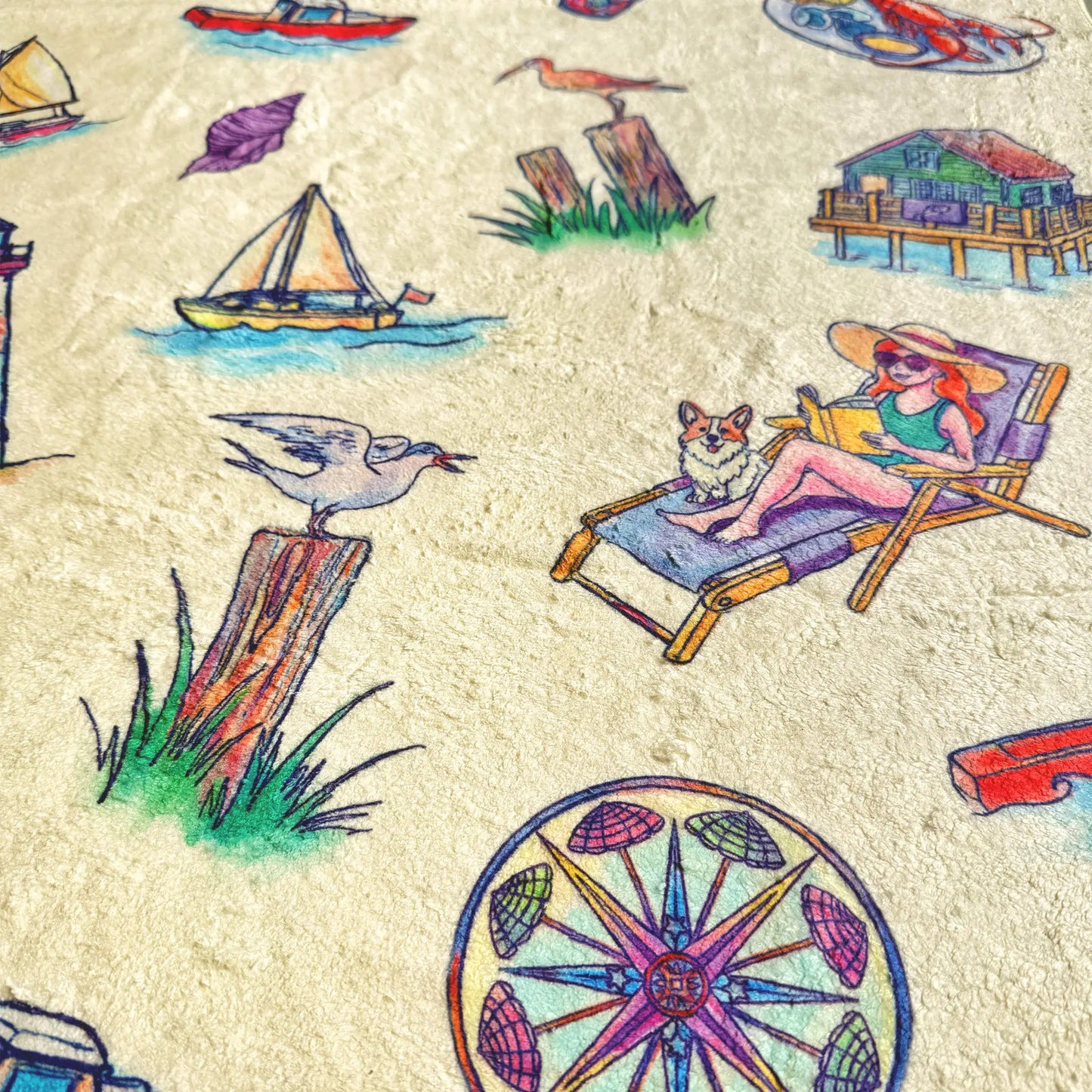 Colorful beach-themed illustrations on a towel