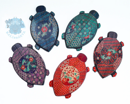 Five hand-painted turtle-shaped board games arranged on a plain white background. Each turtle features intricate  patterns and vibrant colors including blue, green, purple, dark red, and bright red.