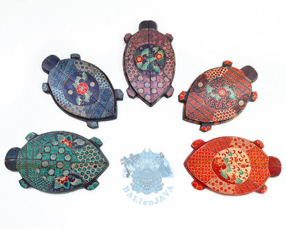 Five wooden mancala board games with turtle shape and hand-painted details, displayed on a white background 